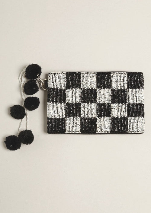 Black/White Checkerboard Seed Bead Coin Purse with Pom Pom-This adorable mini coin purse in the super popular check print is a perfect way to keep small belongings safe in your bigger bag or carry it alone. Makes a great gift or add on gift! 

-Cali Moon Boutique, Plainville Connecticut