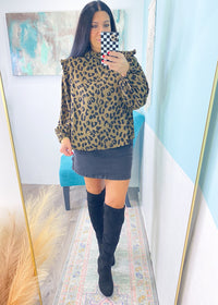 'Wildcat' Ruffle Trim Leopard Print Top-This leopard top is so versatile &amp; can be styled for work &amp; nights out! Wear fully buttoned to show off the ruffle detail or wear unbuttoned under a blazer/sweater for a pop of print. Pairs well with all shades of denim and all neutral colored bottoms.-Cali Moon Boutique, Plainville Connecticut