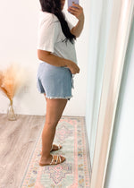 'Double Trouble' Denim Wrap Skort-If the 90's could see us now! This soft denim skort features a super flattering wrap front and adorable fringe trim. Wear super casual with oversized sweaters and sneakers in the Fall or with an embellished bodysuit and boots for a Summer night out! -Cali Moon Boutique, Plainville Connecticut