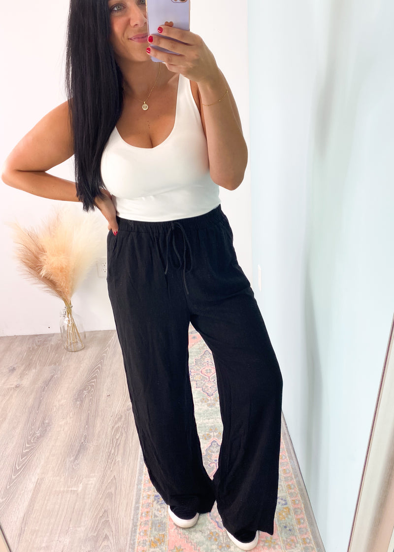 'Eliza' Black Linen Tank & Wide Leg Pant Set-This classic black linen set can be mixed and matched and worn all year! The super soft and high quality linen will keep you comfy all day long. The double layered tank can be worn alone casual and dressed up. Add any color tank for a cool summer time look and add your favorite tee and denim jacket for Fall looks! 
-Cali Moon Boutique, Plainville Connecticut