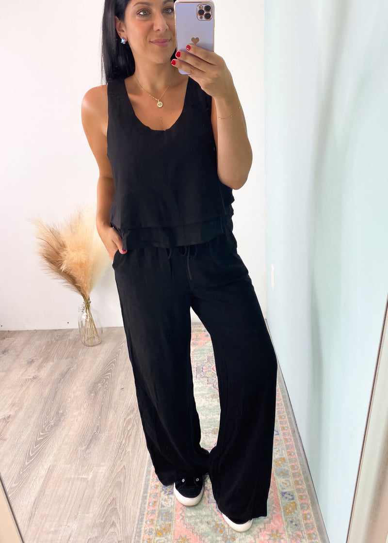 'Eliza' Black Linen Tank & Wide Leg Pant Set-This classic black linen set can be mixed and matched and worn all year! The super soft and high quality linen will keep you comfy all day long. The double layered tank can be worn alone casual and dressed up. Add any color tank for a cool summer time look and add your favorite tee and denim jacket for Fall looks! 
-Cali Moon Boutique, Plainville Connecticut