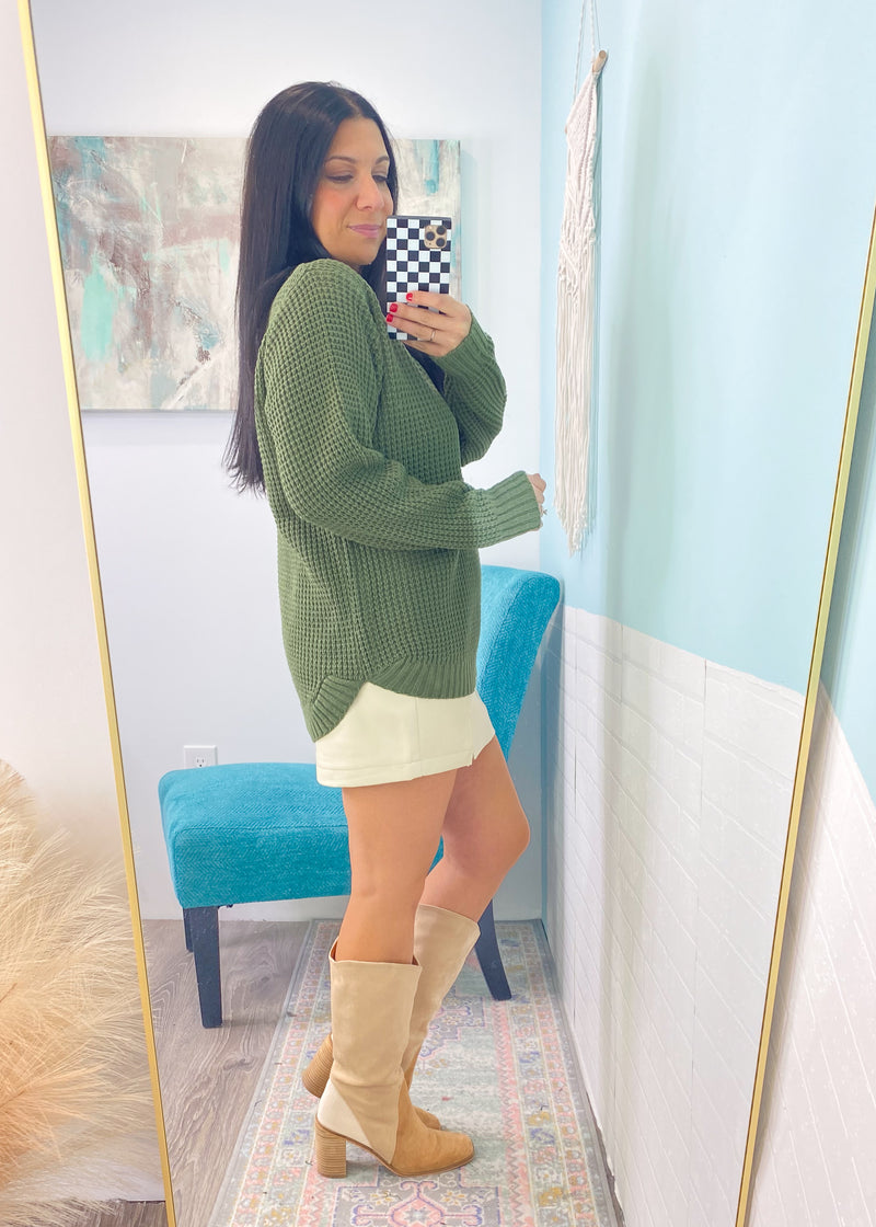 *DOORBUSTER* 'Wendi' Olive Green Waffle Knit Round Neck Sweater-This waffle knit sweater is a must have classic silhouette! The split hem makes it easy to tuck in but also looks cute untucked with the rounded bottom hem. Dress this sweater up with skirts or jeans and boots and layered jewelry or you can wear it super casual with jeans and sneakers. -Cali Moon Boutique, Plainville Connecticut