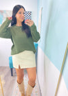 *DOORBUSTER* 'Wendi' Olive Green Waffle Knit Round Neck Sweater-This waffle knit sweater is a must have classic silhouette! The split hem makes it easy to tuck in but also looks cute untucked with the rounded bottom hem. Dress this sweater up with skirts or jeans and boots and layered jewelry or you can wear it super casual with jeans and sneakers. -Cali Moon Boutique, Plainville Connecticut