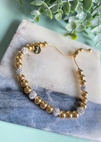 5MM Gold Two Tone Solid & Rhinestone Bead Adjustable Bracelet-A little bling, a little basic! This two tone beaded adjustable bracelet has the best of both worlds. The rhinestone filled beads give off tons of shine.-Cali Moon Boutique, Plainville Connecticut