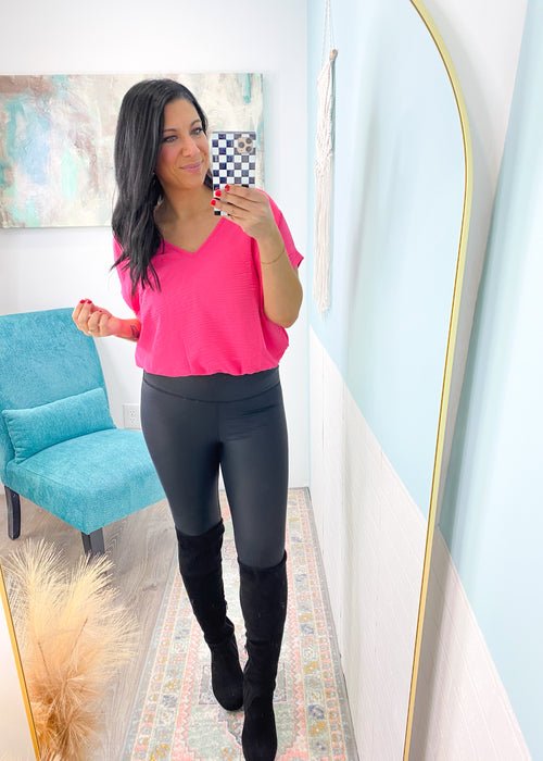 'Bree' Hot Pink Cuffed Short Sleeve Bodysuit-This bodysuit has a relaxed and slouchy fit with permanent cuffed sleeves and soft to the touch body/bottom fabric. Wear this all year for a pop of color layer under a blazer/denim jacket or on its own in the Summer. Flattering V-Neckline is perfect for jewelry stacking!-Cali Moon Boutique, Plainville Connecticut