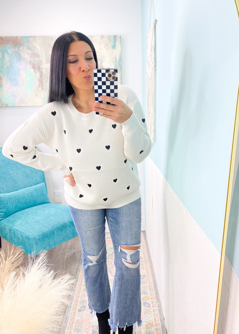 'Cupid's Confetti' Ivory Sweater with Black Embroidered Hearts-Cue the confetti! This sweater is as sweet as they come with a super soft and stretchy fabric, ivory base with black embroidered hearts all over. -Cali Moon Boutique, Plainville Connecticut