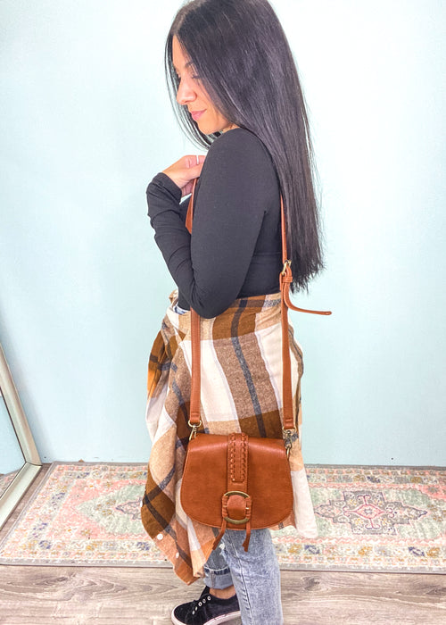 Cognac Braided Front Saddle Crossbody Bag-This crossbody is small enough to comfortably wear all day with enough space for all your must haves. Plus, it's ultra cute & chic in a neutral color that will match with so many outfits! -Cali Moon Boutique, Plainville Connecticut