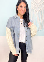'This & That' Denim Shacket with Cable Sweater Sleeves-This shacket is the best of both worlds! A light wash denim body with cozy ivory cableknit sleeves. This neutral color combo will pair with other shades of denim, leggings and colored denim. A must have that will carry you through multiple seasons.-Cali Moon Boutique, Plainville Connecticut