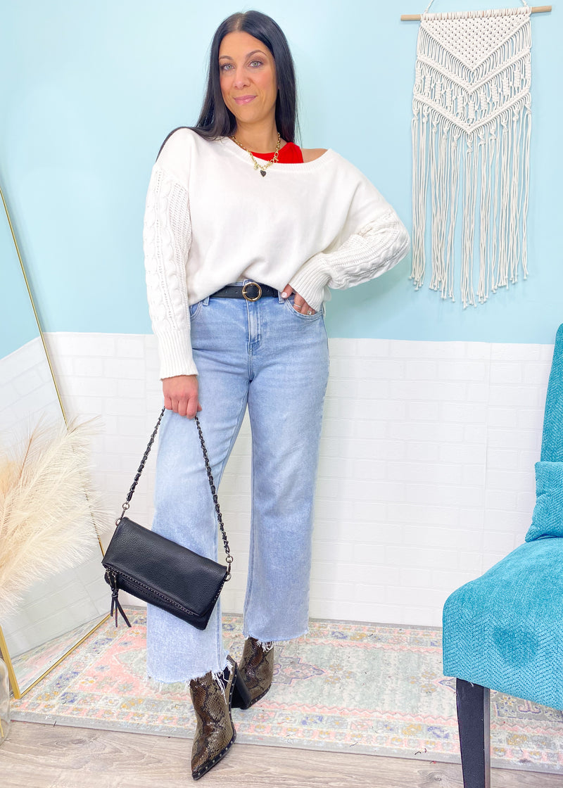 'Charmed' Ivory Cable Sleeve Soft Sweater-Classic cable knit design is perfectly placed in a tonal sleeve on this super soft and cozy sweater. The loose, rounded neckline allows you to wear it regular or slightly off shoulder.

Perfect for: Business casual, night out with boots/jeans, everyday with leggings/jeans with sneakers-Cali Moon Boutique, Plainville Connecticut