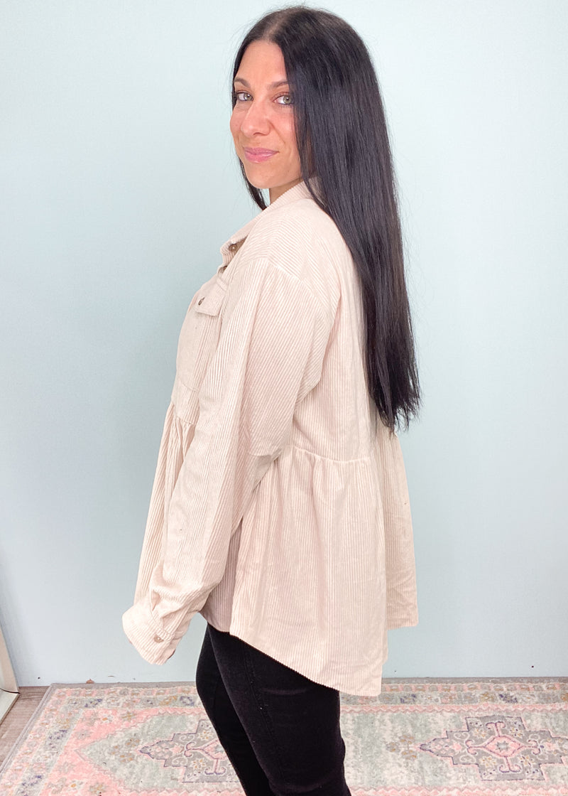 Cream Corduroy Babydoll Top-This corduroy babydoll top is unique, comfortable and can be worn a few different ways! The neutral cream color can be worn with all the rich hues of Fall, all shades of denim and black! It's also work friendly! Wear it as a buttoned up top or layering piece.-Cali Moon Boutique, Plainville Connecticut