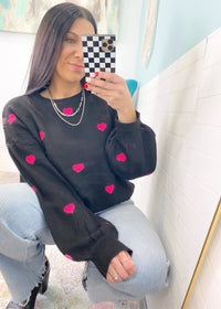 'All My Heart' Black Oversized Sweater with Hot Pink Mini Hearts-You will love the softness of this sweater with all your heart! It has tons of stretch with a&nbsp; soft "fluffy" sweater fabric and pops of hot pink hearts on front and back. Perfect for Valentine's Day or any day you need a warm sweater hug!-Cali Moon Boutique, Plainville Connecticut