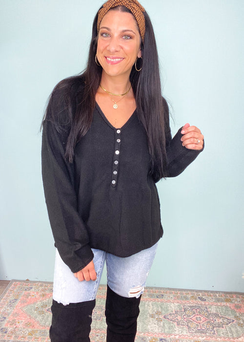Black Henley Button Down Soft Sweater-This black soft sweater is guaranteed to be one of your new fav Fall rotation sweaters! It features the softest fabric with stretch to be worn tucked in, out or knotted. The functional henley buttons can be worn buttoned or unbuttoned for different looks from day to night. Also looks cute off the shoulder! -Cali Moon Boutique, Plainville Connecticut