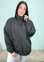 'Caught in the Middle' Black Lightweight Quilted Puffer Jacket-The perfect in between season changing jacket does exist! This Black lightweight quilted puffer jacket is lightweight enough for those days where weather changes a few times and can be worn with long or short sleeves underneath. A Fall must have! -Cali Moon Boutique, Plainville Connecticut