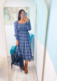 'Verona' Navy Plaid Puff Sleeve Midi Dress-This plaid midi dress is about as cute as you can get for Fall! Transform it from the office with flats to a night out with tall boots &amp; a leather jacket. The smocked bodice makes it as comfy as it is cute!&nbsp;-Cali Moon Boutique, Plainville Connecticut