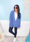 'On a Cloud' Denim Blue Ultra Soft Chenille Button Front Cardigan-This soft as a cloud cardigan in a beautiful denim blue features slouchy, front pockets and a draped look for a casual chic look every time. You will be able to mix &amp; match for so many in or out of the office looks. Wear it slightly off the shoulder, buttoned or unbuttoned for all your different outfits.-Cali Moon Boutique, Plainville Connecticut