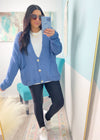 'On a Cloud' Denim Blue Ultra Soft Chenille Button Front Cardigan-This soft as a cloud cardigan in a beautiful denim blue features slouchy, front pockets and a draped look for a casual chic look every time. You will be able to mix &amp; match for so many in or out of the office looks. Wear it slightly off the shoulder, buttoned or unbuttoned for all your different outfits.-Cali Moon Boutique, Plainville Connecticut