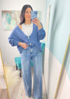 'On a Cloud' Denim Blue Ultra Soft Chenille Button Front Cardigan-This soft as a cloud cardigan in a beautiful denim blue features slouchy, front pockets and a draped look for a casual chic look every time. You will be able to mix &amp; match for so many in or out of the office looks. Wear it slightly off the shoulder, buttoned or unbuttoned for all your different outfits.-Cali Moon Boutique, Plainville Connecticut