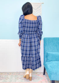 'Verona' Navy Plaid Puff Sleeve Midi Dress-This plaid midi dress is about as cute as you can get for Fall! Transform it from the office with flats to a night out with tall boots &amp; a leather jacket. The smocked bodice makes it as comfy as it is cute!&nbsp;-Cali Moon Boutique, Plainville Connecticut