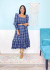 'Verona' Navy Plaid Puff Sleeve Midi Dress-This plaid midi dress is about as cute as you can get for Fall! Transform it from the office with flats to a night out with tall boots &amp; a leather jacket. The smocked bodice makes it as comfy as it is cute!&nbsp;-Cali Moon Boutique, Plainville Connecticut