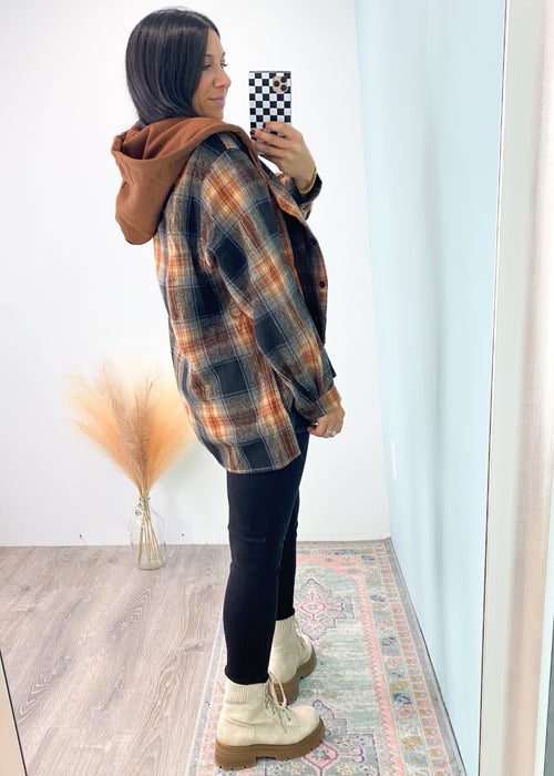'Fall Day' Oversized Black/Pecan Plaid Fleece Shacket with Hood-The oversized plaid shacket that dreams are made of! Warm and cozy colors on a brushed flannel fabric topped off with a hood for both function and design! Oversized to wear slouchy and casual all Fall/Winter long! 

-Cali Moon Boutique, Plainville Connecticut
