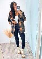 'Fall Day' Oversized Black/Pecan Plaid Fleece Shacket with Hood-The oversized plaid shacket that dreams are made of! Warm and cozy colors on a brushed flannel fabric topped off with a hood for both function and design! Oversized to wear slouchy and casual all Fall/Winter long! 

-Cali Moon Boutique, Plainville Connecticut