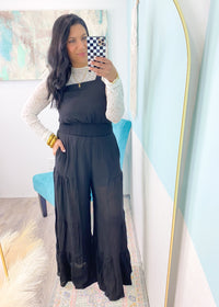 'Alayna' Black Super Wide Leg Ruffle Jumpsuit-This one is for the wide leg lovers! Lightweight, wide leg black jumpsuit that will get you ALL the compliments. The tiered ruffle leg is fun &amp; unique, plus the overall fit is extremely comfortable! You're already crowned best dressed for your next event!-Cali Moon Boutique, Plainville Connecticut