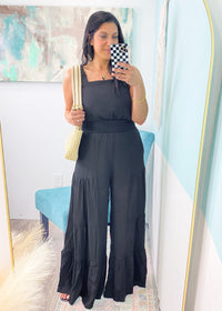 'Alayna' Black Super Wide Leg Ruffle Jumpsuit-This one is for the wide leg lovers! Lightweight, wide leg black jumpsuit that will get you ALL the compliments. The tiered ruffle leg is fun &amp; unique, plus the overall fit is extremely comfortable! You're already crowned best dressed for your next event!-Cali Moon Boutique, Plainville Connecticut