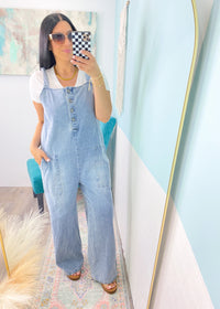'She's All That' Wide Leg Trouser Jean Jumpsuit-This jean jumpsuit is all that and so much more! The wide leg trouser style looks good with heels, sneakers, boots &amp; sandals. The denim is non rigid which we love! Wear it alone with your fav bandeaus or layer with tanks, bodysuits, tees and long sleeve tops in the Fall/Winter. Add a belt for a more structured outfit.-Cali Moon Boutique, Plainville Connecticut