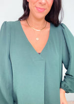 'In a Pinch' Hunter Green V-Neck Pinched Shoulder Blouse-This hunter green top has the most flattering notched v-neck front and draped fabric. It can be worn more dressed up with black pants, skirts and leggings or wear it with any shade of denim and boots for a night out! Great for work, the Holidays or anytime!-Cali Moon Boutique, Plainville Connecticut