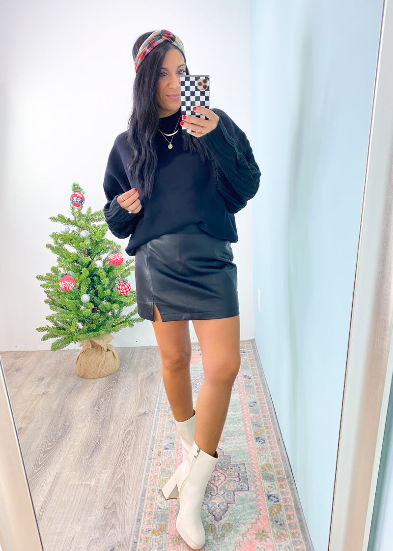 'Runway' Black Split Hem Soft Faux Leather Skirt-Turn heads in this super soft faux leather mini skirt! It features a split front detail, back zipper and is super comfy. No crinkle sounds when you walk! Wear all year 'round for nights out and special parties! -Cali Moon Boutique, Plainville Connecticut