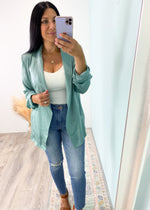 'Keep Calm' Sage Lightweight Satin Relaxed Fit Blazer-This Sage blazer in a lightweight satin like fabric can be worn year 'round! Looks great with whites and pastels in the Summer just as well as it does with grays and dark taupes/neutrals in the Fall/Winter.
-Cali Moon Boutique, Plainville Connecticut