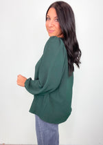 'In a Pinch' Hunter Green V-Neck Pinched Shoulder Blouse-This hunter green top has the most flattering notched v-neck front and draped fabric. It can be worn more dressed up with black pants, skirts and leggings or wear it with any shade of denim and boots for a night out! Great for work, the Holidays or anytime!-Cali Moon Boutique, Plainville Connecticut