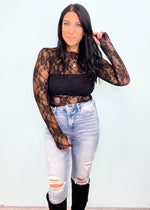 'Be Seen' Black Ruffle Trim Sheer Lace Top-Grab the layering piece of the season! This sheer black lace top can be worn under anything from sweaters, vests and blazers to dresses & jumpsuits! -Cali Moon Boutique, Plainville Connecticut