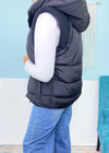 'After Dusk' Black Puffer Vest With Hood-The knit ribbed cap shoulder detail sets this black puffer vest apart from all the others! A soft nylon puffer style with a hood that can be retracted. A Fall/Winter must have!-Cali Moon Boutique, Plainville Connecticut