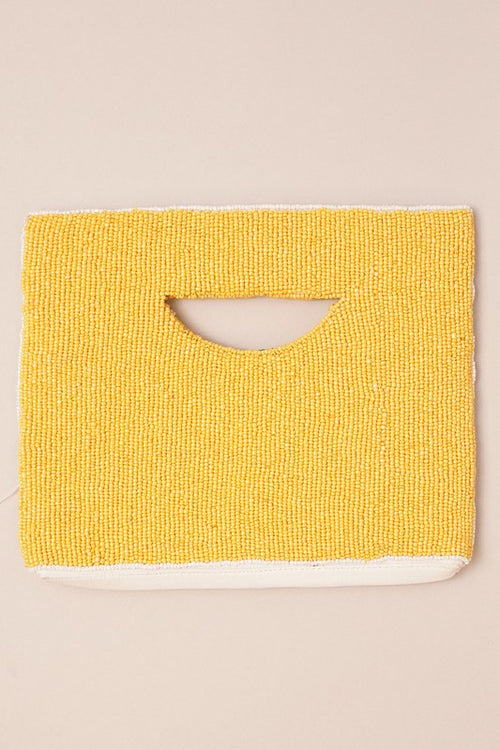 Lemon Seed Bead Handbag with Handle-Stand out from the crowd with this unique seashell handbag made with seed beads and can be worn as a crossbody, shoulder bag or clutch!

-Cali Moon Boutique, Plainville Connecticut