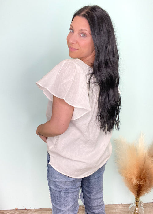 'Faith' Off White Square Neck Flutter Sleeve Top-Feel the warm island breeze when we look at this lightweight flowy top! The gauze like fabric is perfect for Spring & Summer. The flutter sleeves add a feminine touch. A super easy-to-style top that can be tucked in for an effortless look.-Cali Moon Boutique, Plainville Connecticut