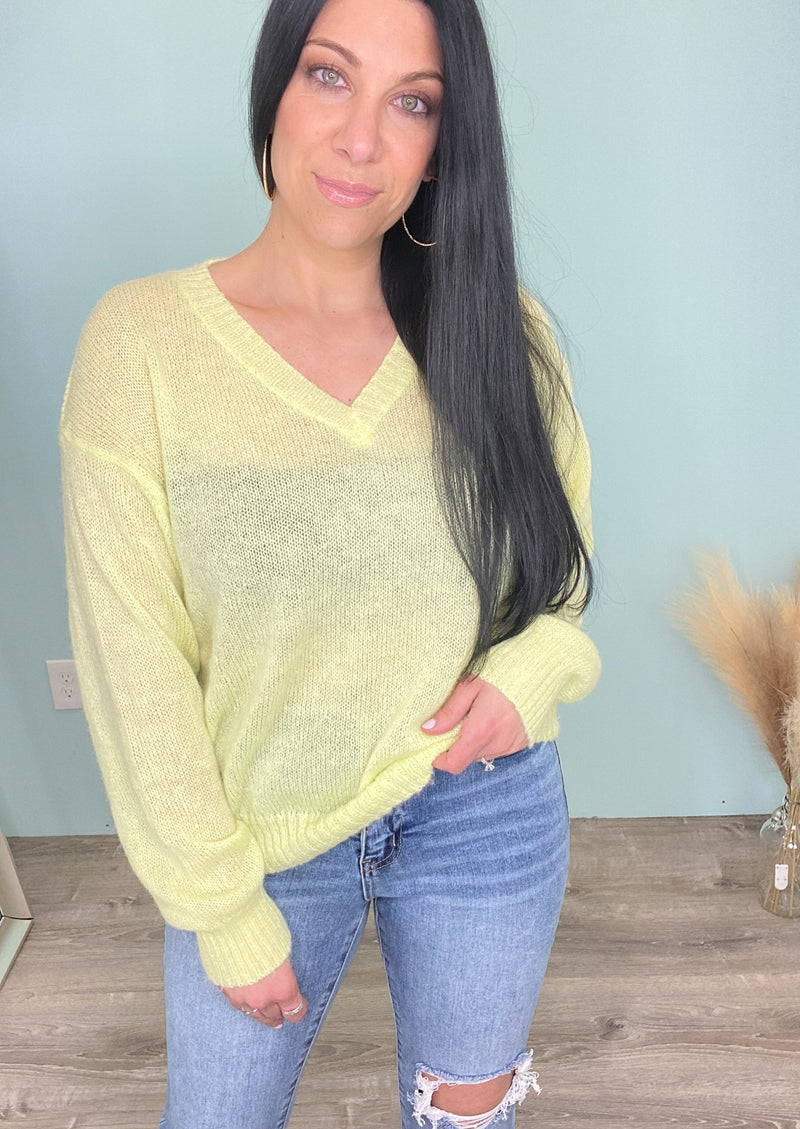 'Lemon Drop' Lightweight Semi Sheer Lemon Sweater-The perfect Spring sweater has arrived! The light lemon color lightweight sweater is a perfect way to brighten up your wardrobe & the classic relaxed v-neck silhouette can be styled so many ways! Front tuck into your favorite pair of jeans and jean shorts for an effortless styled look. Wear with linen pants for a chic vacation outfit! -Cali Moon Boutique, Plainville Connecticut