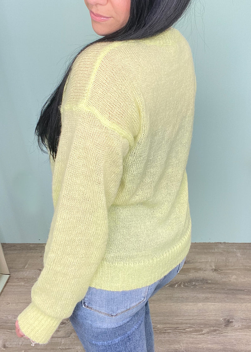 'Lemon Drop' Lightweight Semi Sheer Lemon Sweater-The perfect Spring sweater has arrived! The light lemon color lightweight sweater is a perfect way to brighten up your wardrobe & the classic relaxed v-neck silhouette can be styled so many ways! Front tuck into your favorite pair of jeans and jean shorts for an effortless styled look. Wear with linen pants for a chic vacation outfit! -Cali Moon Boutique, Plainville Connecticut