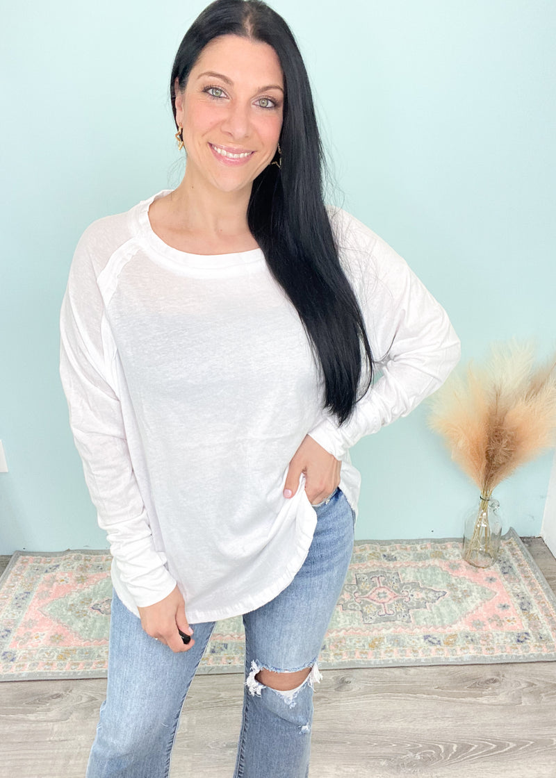 'Light Breeze' White Long Sleeve Raglan Tee with Thumb Holes-This white long sleeve tee is easy breezy to throw on and go for a comfy everyday vibe. Pair with denim, shorts and leggings. The rounded hem gives a cute front tuck look!-Cali Moon Boutique, Plainville Connecticut