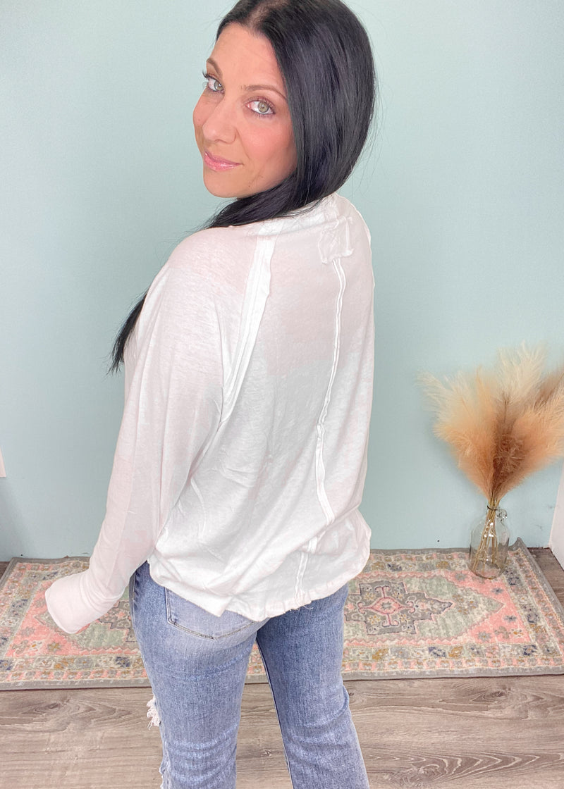 'Light Breeze' White Long Sleeve Raglan Tee with Thumb Holes-This white long sleeve tee is easy breezy to throw on and go for a comfy everyday vibe. Pair with denim, shorts and leggings. The rounded hem gives a cute front tuck look!-Cali Moon Boutique, Plainville Connecticut